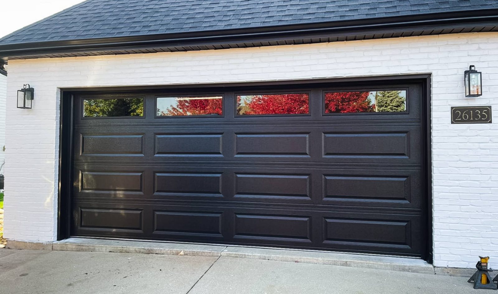 Black raised-panel garage door