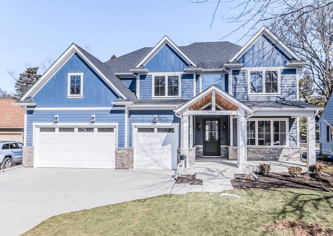 Custom white raised-panel garage door